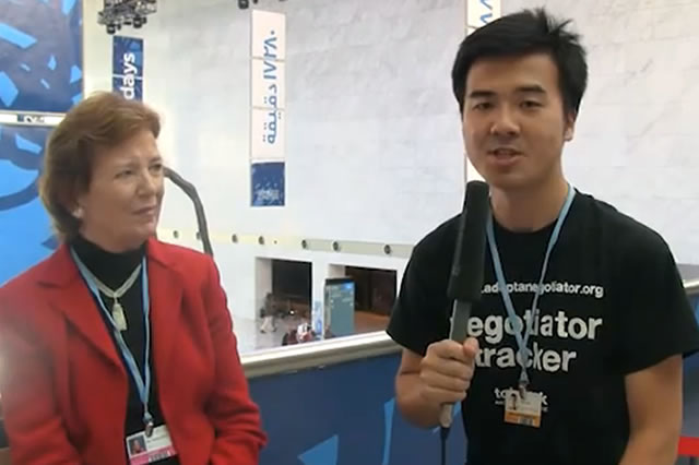 Marvin Nala, China Tracker talking with Mary Robinson at COP18 in Doha